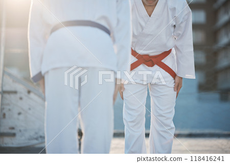 Karate, bow and men outdoor for training, workout and start exercise in city. Martial arts, sports and people in competition for taekwondo, battle and challenge to fight for healthy body in fitness 118416241
