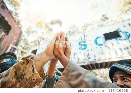 Paintball, hands and high five for teamwork, support or trust in game plan, collaboration or unity on battle field. Group of paintballers touching hand for team building motivation before match start 118416368