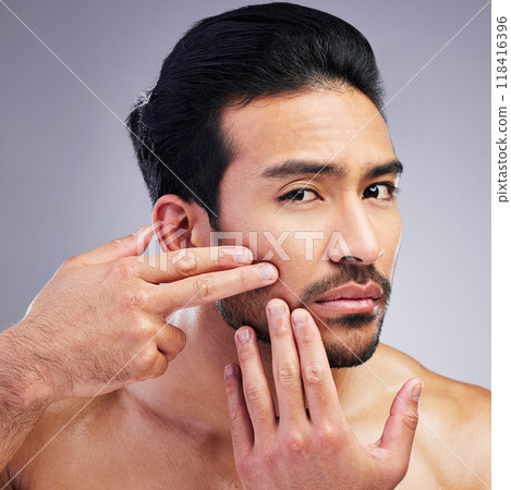 Portrait, studio or man check skin blackhead, melasma or pimple breakout during facial cleaning, grooming or morning routine. Anxiety, face acne or spa person with skincare problem on gray background 118416396