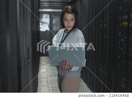 Woman with laptop, server room and IT, engineer and datacenter with software update and programming. Tech industry, cybersecurity and network with Asian female setting up firewall and database Woman with laptop, server room and IT, engineer and datacenter with software update and programming. Tech industry, cybersecurity and network with Asian female setting up firewall and database 118416488