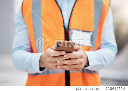 Phone, construction site and search with hands of person for engineering, architecture and communication. Building, social media and mobile app with closeup of contractor for contact and networking 118416534
