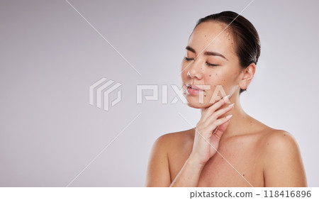 Skincare, hand on face and woman with mockup space in studio for beauty, dermatology and cosmetics. Aesthetic asian model with makeup, skin glow and luxury self care facial results on grey background Skincare, hand on face and woman with mockup space in studio for beauty, dermatology and cosmetics. Aesthetic asian model with makeup, skin glow and luxury self care facial results on grey background 118416896