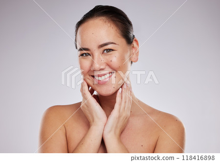 Beauty, hands on face and portrait of woman in studio for skincare, dermatology and cosmetics for skin. Aesthetic asian model smile for makeup glow and luxury self care facial for health and wellness 118416898