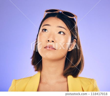 Thinking, woman and face with sunglasses for fashion, idea or think of summer holiday on purple studio background. Choice, decision and Asian model with glasses on head with cool gen z style Thinking, woman and face with sunglasses for fashion, idea or think of summer holiday on purple studio background. Choice, decision and Asian model with glasses on head with cool gen z style 118417018