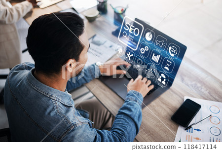 SEO, digital and businessman with laptop in an office for analysis, email or work on technology. Website, corporate and an employee typing on a computer for marketing or professional market research 118417114