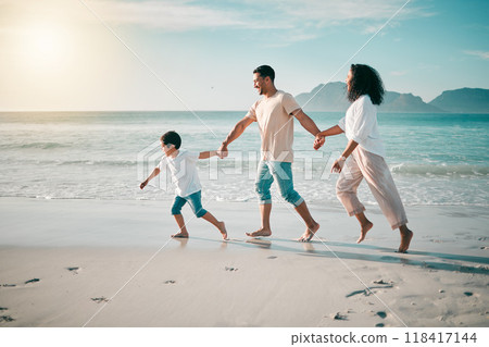 Running, flare and a family holding hands on the beach while walking during travel, vacation or bonding. Love, children and parents on sand at the coast by an ocean or sea for summer holiday fun Running, flare and a family holding hands on the beach while walking during travel, vacation or bonding. Love, children and parents on sand at the coast by an ocean or sea for summer holiday fun 118417144