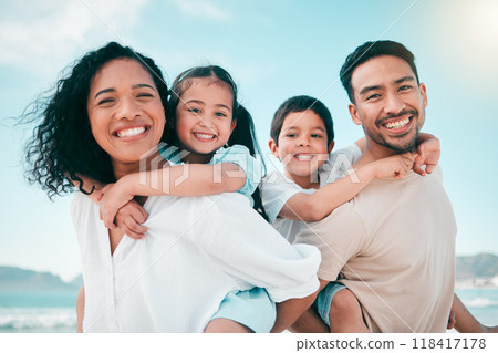 Family on beach, parents piggyback children in portrait with bonding on holiday, happy people and smile with travel. Mom, dad and young kids, tropical vacation in Mexico with love and care outdoor 118417178