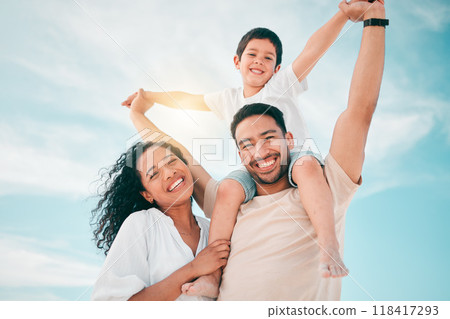 Happy family, portrait and airplane games at a beach with freedom, bond and fun together on blue sky background. Face, love and piggyback by parents and boy child outdoor for travel, holiday or trip 118417293