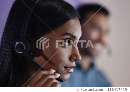 Woman, call center and headphones at night in customer service, support or telemarketing at the office. Face of serious female person, consultant or agent with headset for online advice or assistance Woman, call center and headphones at night in customer service, support or telemarketing at the office. Face of serious female person, consultant or agent with headset for online advice or assistance 118417429