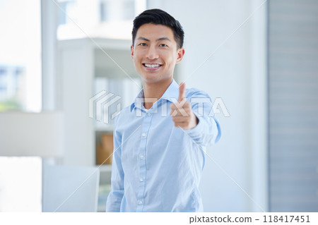 Thumbs up, portrait and happy business man in office with winning, sign or thank you gesture. Face, smile and asian male entrepreneur with hand emoji or vote for yes, like and satisfaction or approve Thumbs up, portrait and happy business man in office with winning, sign or thank you gesture. Face, smile and asian male entrepreneur with hand emoji or vote for yes, like and satisfaction or approve 118417451