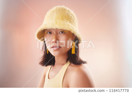 Asian woman, fashion and cosmetics with gen z and portrait, yellow aesthetic and edgy on studio background. Streetwear, beauty and makeup with style, female face and mockup space with fog or smoke 118417778