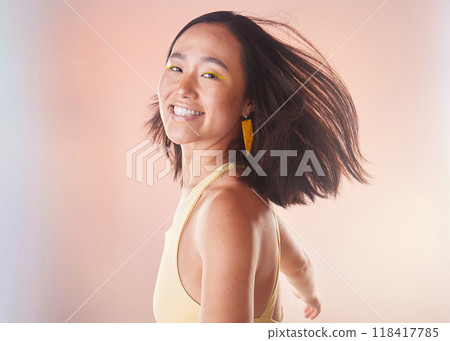 Portrait, fashion and beauty with a model asian woman in studio on a neon background for style. Face, carefree and freedom with an attractive young female standing alone for natural cosmetics 118417785