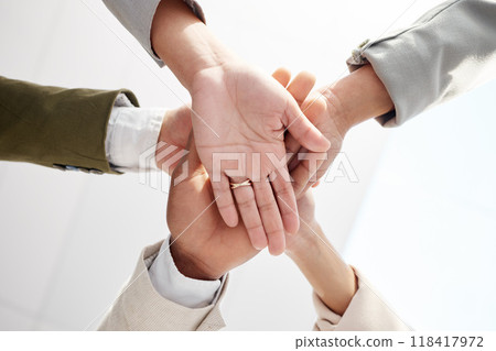 Business people, hands together and solidarity with team support, low angle and motivation in office. Success, collaboration and corporate group with teamwork, professional community and workforce 118417972