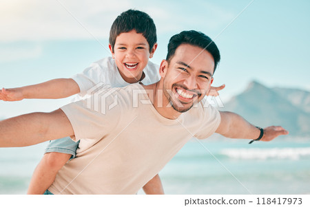 Airplane, portrait and father with boy child at a beach with freedom, fun and bonding in nature. Flying, love and face of parent with kid at the ocean for travel, playing and piggyback games in Bali 118417973