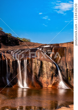 Tham Phra Waterfall Waterfall located in Bueng Kan Province, Thailand. There will be little water in the summer 118418230