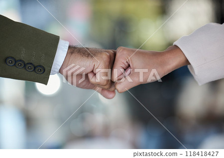 Hands, fist bump and trust in corporate partnership for unity, agreement or deal against blurred background. Hand of people bumping fists in collaboration for teamwork, goals or support for winning Hands, fist bump and trust in corporate partnership for unity, agreement or deal against blurred background. Hand of people bumping fists in collaboration for teamwork, goals or support for winning 118418427