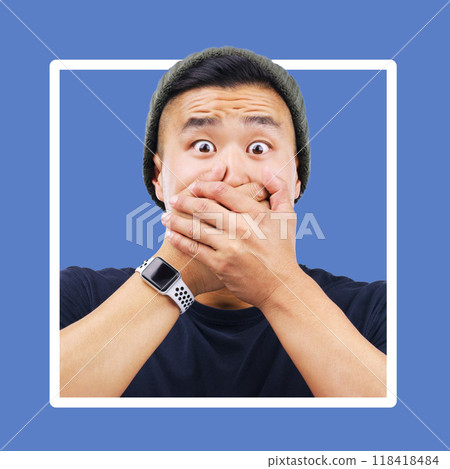 Portrait, man and hands over mouth for wow, shocked and news in studio for advertising on blue background. Omg, face or emoji by asian guy shock for secret, drama or secret on mockup space isolated Portrait, man and hands over mouth for wow, shocked and news in studio for advertising on blue background. Omg, face or emoji by asian guy shock for secret, drama or secret on mockup space isolated 118418484