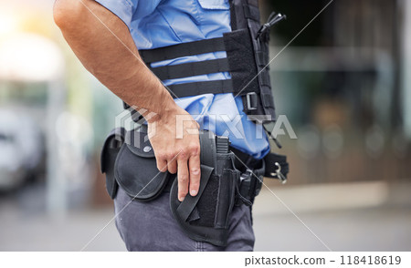 Gun, uniform and police in the city for crime, security and outdoor justice in the street. Law, safety and a closeup of a man with a weapon in town for legal services, criminal or protection 118418619