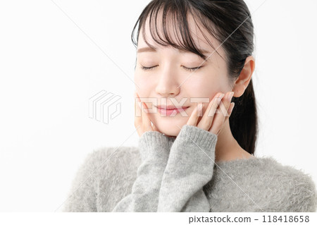 Woman touching her skin condition Woman touching her skin condition 118418658