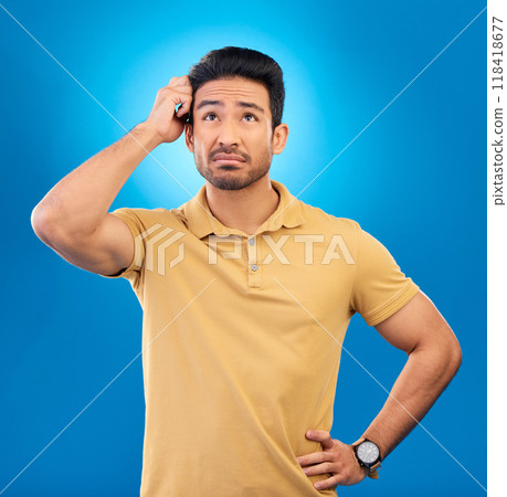 Thinking, ideas and confused man brainstorming promo, problem solving plan or commercial strategy. Planning, space and studio person with questions, decision or doubt choice on blue background 118418677