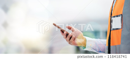Phone, architecture and hands of person on construction site for engineering, space and communication. Building, social media and banner with closeup of contractor for contact, networking and mockup 118418741