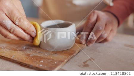 Pottery, hands and clay dish, container or bowl in studio, workshop or classroom. Artist, craft and hobby with creativity, unique mold, shape or handmade ceramic product, design and process with care 118418801