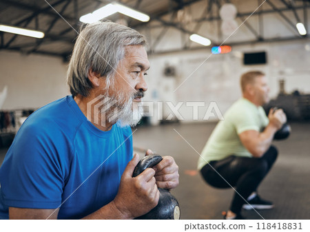 Fitness, senior and man workout with personal trainer at the gym squat with kettlebell equipment for strength. Elderly, old and training people exercise in a sports club for wellness and health 118418831