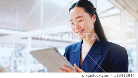 Asian business woman, tablet and smile in office for planning online report, search information and app. Happy corporate worker scroll on digital technology, social network and update data on website 118418914