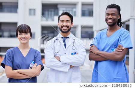 Portrait, healthcare or collaboration with a doctor and team standing arms crossed outside of a hospital. Medical, teamwork or trust with a man and woman professional medicine group feeling confident 118418935