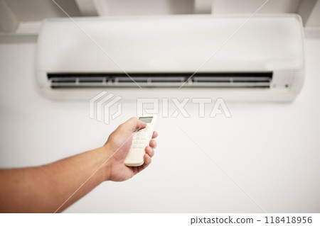 Air conditioner, hand and remote for electrical machine check with person in a home with ac repair. Maintenance, and system control for installation, inspection of aircon fix in house with contractor Air conditioner, hand and remote for electrical machine check with person in a home with ac repair. Maintenance, and system control for installation, inspection of aircon fix in house with contractor 118418956