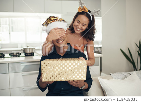 Happy birthday, gift and surprise of couple of friends with present for celebration, love and happy valentines. Christmas, holiday and people with present or box to celebrate in home or living room 118419033