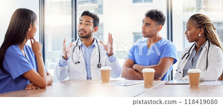 Meeting, coaching and healthcare with a doctor and team in a hospital boardroom for training or discussion. Teamwork, leadership or learning with a medicine professional talking to nurses in a clinic 118419080