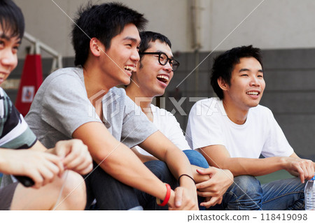 Asian men, group and students at campus with smile, relax and excited together at college, education and outdoor. Happy Japanese friends, comic joke and laugh with solidarity at university in Tokyo 118419098