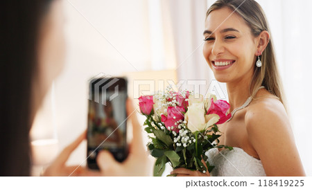 Picture, bride and flowers with friends in bedroom for social media, celebration and photography. Wedding, bridal party and beauty with women at home for streaming, post and update together Picture, bride and flowers with friends in bedroom for social media, celebration and photography. Wedding, bridal party and beauty with women at home for streaming, post and update together 118419225
