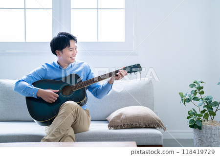 Man playing guitar 118419729