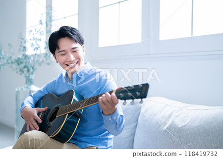 Man playing guitar 118419732