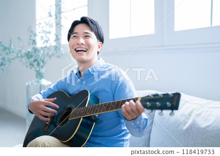 Man playing guitar Man playing guitar 118419733