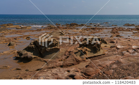 Eroded Rocks and Tide Pools on a Mediterranean Coastline 118420483