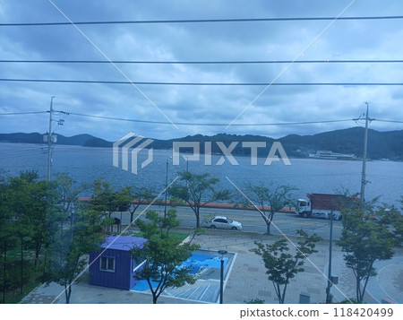 Tongyeong-si, Gyeongsangnam-do, South Korea - September 15, 2024: Enjoyable lunch with the family at an Italian restaurant with a great sea view. Tongyeong-si, Gyeongsangnam-do, South Korea - September 15, 2024: Enjoyable lunch with the family at an Italian restaurant with a great sea view. 118420499