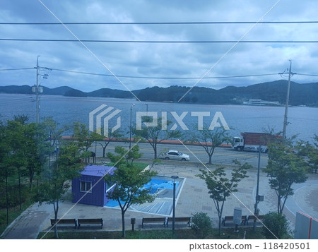 Tongyeong-si, Gyeongsangnam-do, South Korea - September 15, 2024: Enjoyable lunch with the family at an Italian restaurant with a great sea view. Tongyeong-si, Gyeongsangnam-do, South Korea - September 15, 2024: Enjoyable lunch with the family at an Italian restaurant with a great sea view. 118420501