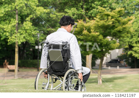 Male doctor/physician in a wheelchair outdoors 118421197