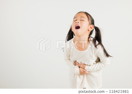 Portrait of Asian young kid girl has stomachache, kindergarten child abdominal pain suffering from stomach ache, studio shot isolated on white background, food poisoning, Health and medical gastritis Portrait of Asian young kid girl has stomachache, kindergarten child abdominal pain suffering from stomach ache, studio shot isolated on white background, food poisoning, Health and medical gastritis 118421981