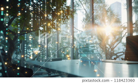 A computer monitor sits on a desk in front of a window with a tree outside A computer monitor sits on a desk in front of a window with a tree outside 118423360