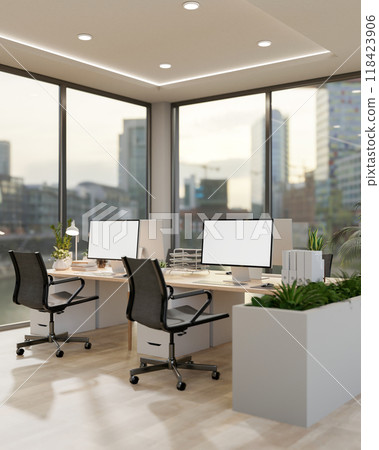 A modern office in a skyscraper features computers on desks by the window with a stunning view. A modern office in a skyscraper features computers on desks by the window with a stunning view. 118423906