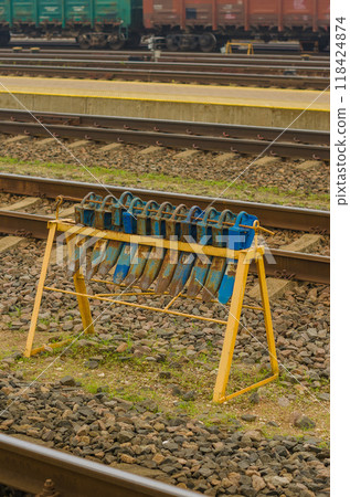 The brake shoe is on the rail under the wheel of the wagon with a rolling. High quality photo 118424874