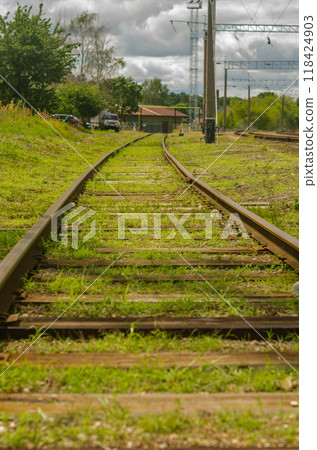 old Railroad track in a pile of gravel. railway pattern background. High quality photo old Railroad track in a pile of gravel. railway pattern background. High quality photo 118424903