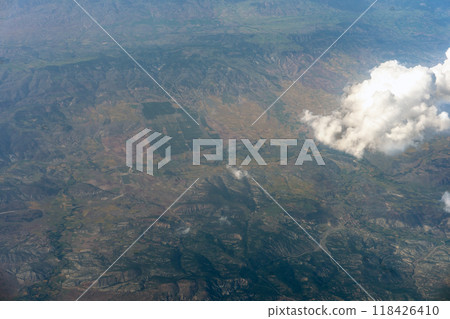 Aerial View from Jet Airliner: Clouds and Towns Below Aerial View from Jet Airliner: Clouds and Towns Below 118426410