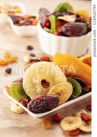 Dried tropical fruits with various nuts and raisins. 118426794