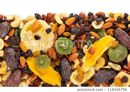Dried tropical fruits, nuts, and raisins isolated on white. Dried tropical fruits, nuts, and raisins isolated on white. 118426796