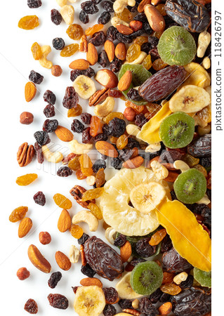 Dried tropical fruits, nuts, and raisins isolated on white. 118426797